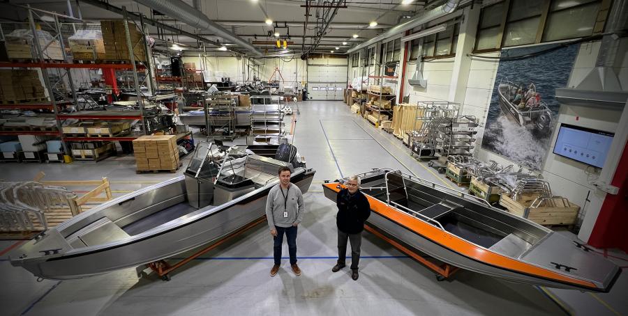 Boat designers Aleksi Juusti and Antti Hietaharju at the Inha Works with aluminium boats Buster M2 and Buster RS